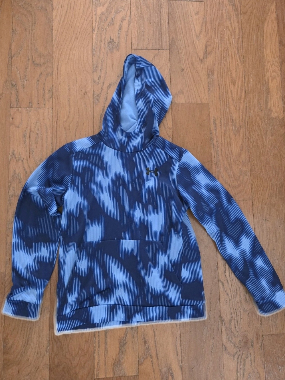 IUnder Armour Blue Patterned Hooded Sweater. Camera Highlighted Bottom
